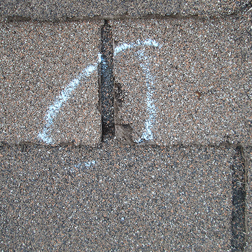 hail damage on a shingle