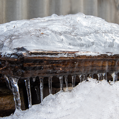 ice hanging from a roof